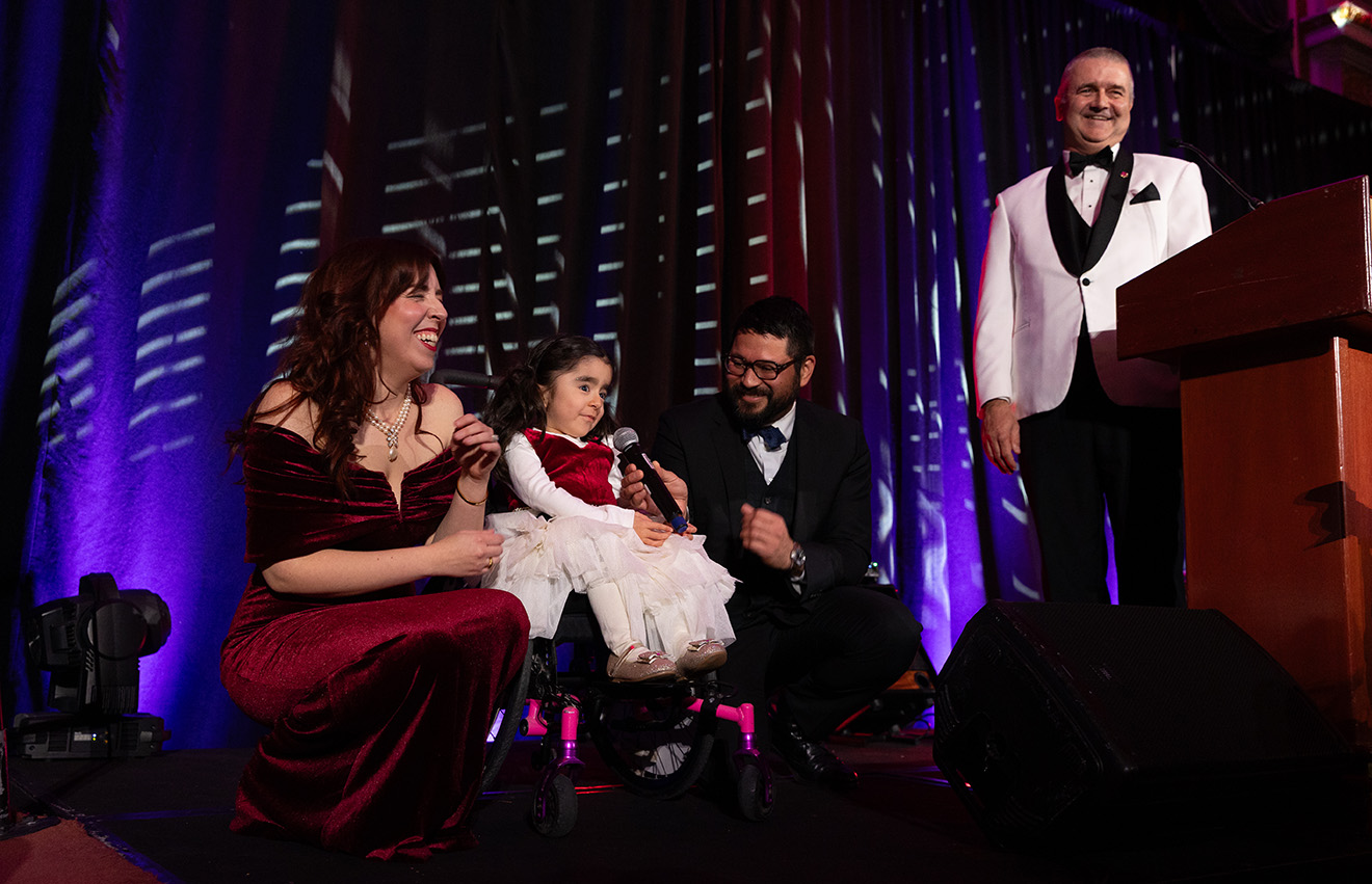 Cece on stage with her parents and Steve Read, CEO.